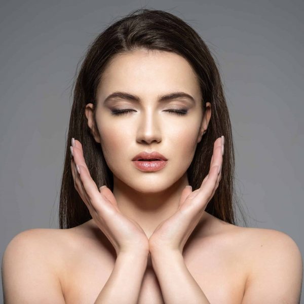 Portrait of beautiful young brunette woman with clean face.